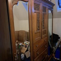old gentleman's wardrobes, 2 wardrobe bevelled glass doors huge centre cupboards which can be locked and 4 draws getting bigger as they go down, can be broken down easily too move.