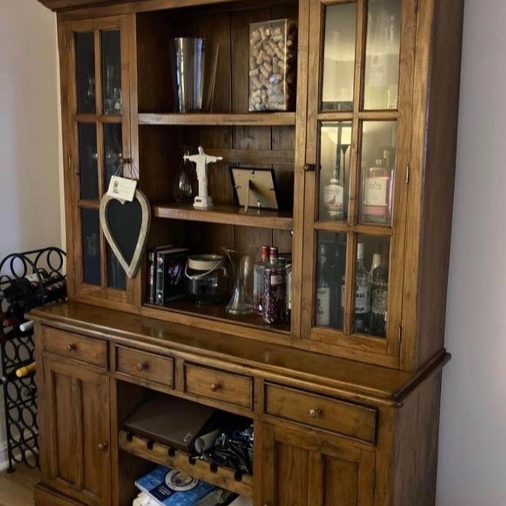 Large solid wood rustic dresser/display cabinet. A really heavy piece of quality furniture built to last. Loads of storage space inside with glass cupboards & display shelves at the top. The bottom has 4 x storage drawers, 2 large cupboards with shelves inside & a removable wine rack in the centre. The unit measures 165cm wide x 50cm deep x 220cm tall & separates into 2 pieces for moving. Viewing/collection is Leeds LS24 & delivery is available if required - £295