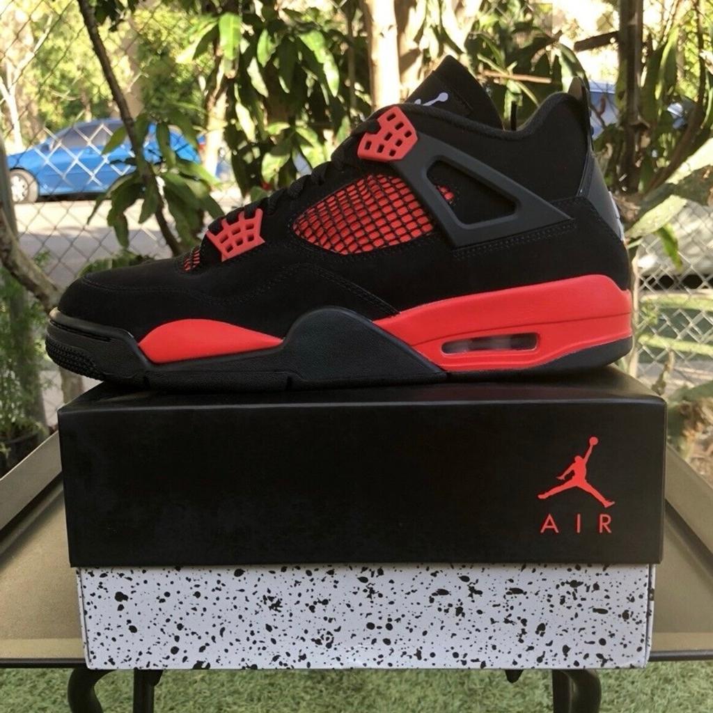 The Air Jordan 4 Retro ‘Red Thunder’ features familiar color blocking that recalls the coveted ‘Thunder’ colorway, originally released in 2006 and subsequently reissued in 2012. The mid-top sports a black nubuck upper with contrasting pops of crimson in lieu of the older shoe’s Tour Yellow accents. They appear on the sneaker’s molded eyelets, interior tongue, quarter panel, throat and midsole, which packs visible Air-sole cushioning under the heel. Jumpman branding decorates the tongue tag and heel.