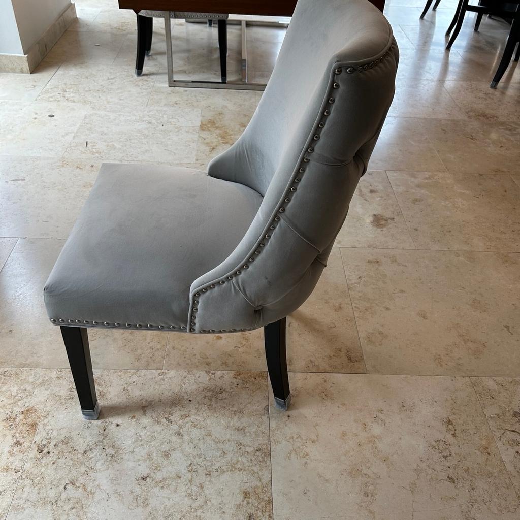 10 grey Coach House dining chairs good condition
Chair 96 cm high
Seat 56cm wide
Height of seat 46 cm
Detail on back of chair with silver studs and grey buttons
Wenge legs