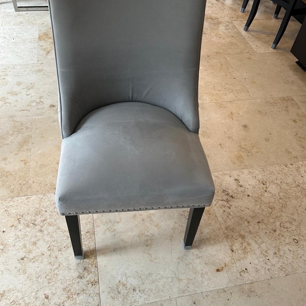 10 grey Coach House dining chairs good condition
Chair 96 cm high
Seat 56cm wide
Height of seat 46 cm
Detail on back of chair with silver studs and grey buttons
Wenge legs