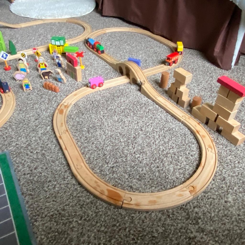 This is a set of three wooden train tracks and would have enough pieces to probably have two big ones.
The collection comes with everything in the pictures including the play mat and vehicles along with the wooden blocks and accessories.

This has come from my out of school club so has had many years of playing and still has many years left.

It would be a great add on to any collection and comes with the box and lid pictured.

I have wiped and washed everything but may still need a little wipe as this has come out of storage but cleaned and dried before packed away.