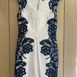 Lovely like new body con fitted dress 

cream with black lace down sides and on shoulders 

Thick material

Check out my other items.