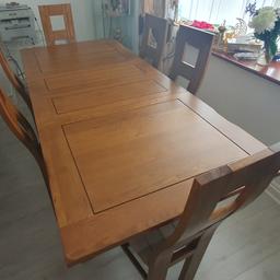 Extendable Dining Table Set. Has up to 3FT of extension (Two 1.5FT extensions). Table extends from the middle using two independent leaves. Has always had a cover on top so absolutely no scratches, dents etc. When fully extended, the table can seat up to six people comfortably. Made from solid oak. Softly rounded corners, chamfered edges. Comes with 6 chairs (includes seat covers). The first chair picture is with cover.
Width: 140cm
Height: 77cm
Depth: 90cm
4ft 7" (+ 3ft Extending).