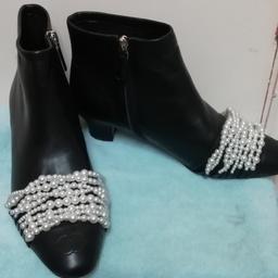 Italian soft leather ankle boots, with fashionable Pearl detail and a low heel . Only tried on inside