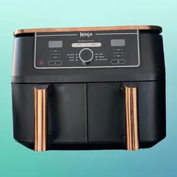 Hardly used only selling due to flat move. RRP £269!

Exclusive - This 6-in-1 Dual Zone Air Fryer features sleek copper accents and includes a pair of Silicone Tongs. 6 cooking functions: Max Crisp, Air Fry, Roast, Bake, Reheat, Dehydrate
ENERGY-SAVING: Save up to 65% on your energy bill* (*testing and calculations based on recommended cook time for sausages, using air fry function versus conventional ovens)
2 INDEPENDENT COOKING ZONES: Cook 2 foods, 2 ways, both ready at the same time. Quick, complete meals using no oil. Air Fry: up to 75% less fat* (*Tested against deep fried, hand-cut French fries)
EXTRA-LARGE CAPACITY: Cook up to 8 portions. Each drawer fits up to 1.4kg fries or a 2kg chicken. Cook up to 75% faster than fan ovens* (*Tested against fish fingers and sausages, including preheat)
INCLUDES: Silicone tongs, 2x non-stick dishwasher-safe 4.75L Drawers (9.5L total capacity) & Crisper Plates. Chef-created Recipe Guide. Weight: 8.8kg. Colour: Copper/Black.