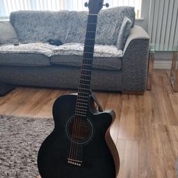 only four weeks old Donner acoustic guitar comes with bag stand and accessories