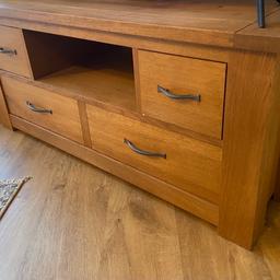 Solid oak TV stand from Next, beautiful wood. 
Only selling due to decorating and making space, good condition, sad to part with it. 
Collection only WV11

Height: 20 inches 
Width: 45 inches
Depth: 20 inches 

Also selling matching book case if interested, drop me a message.