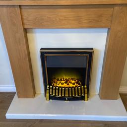 Electric fire and surround 

Height: 43 inches 
Width: 48 inches 
Depth: 15 inches 

Light damage to grate from general usage. 
Collection only 
WV11