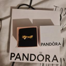 Pandora gold bow ring, im unsure of exact size. i think its a 54 because of sizing of my other which i no is a 52. collection only from speke