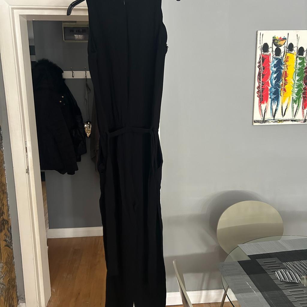 Jumpsuits are the perfect one-and-done outfits. This Massimo Dutti black all in one is the perfect alternative to the classic LBD guaranteed to sculpt those curves and streamline your figure.