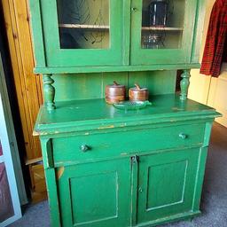 I'm posting this for a friend...
We have a beautiful green French dresser as shown. It's in really nice, usable condition, with lots of storage/display room, as a good dresser should have.
The top lifts off for easier transportation. 
Please see the images for a detailed picture of it. 
Dimensions: 183cm tall, 103cm wide, depth at the top is 29cm, and depth at the bottom is 50cm.
Price is non-negotiable, so please don't get in touch to haggle. 
If you need any further details, feel free to ask.