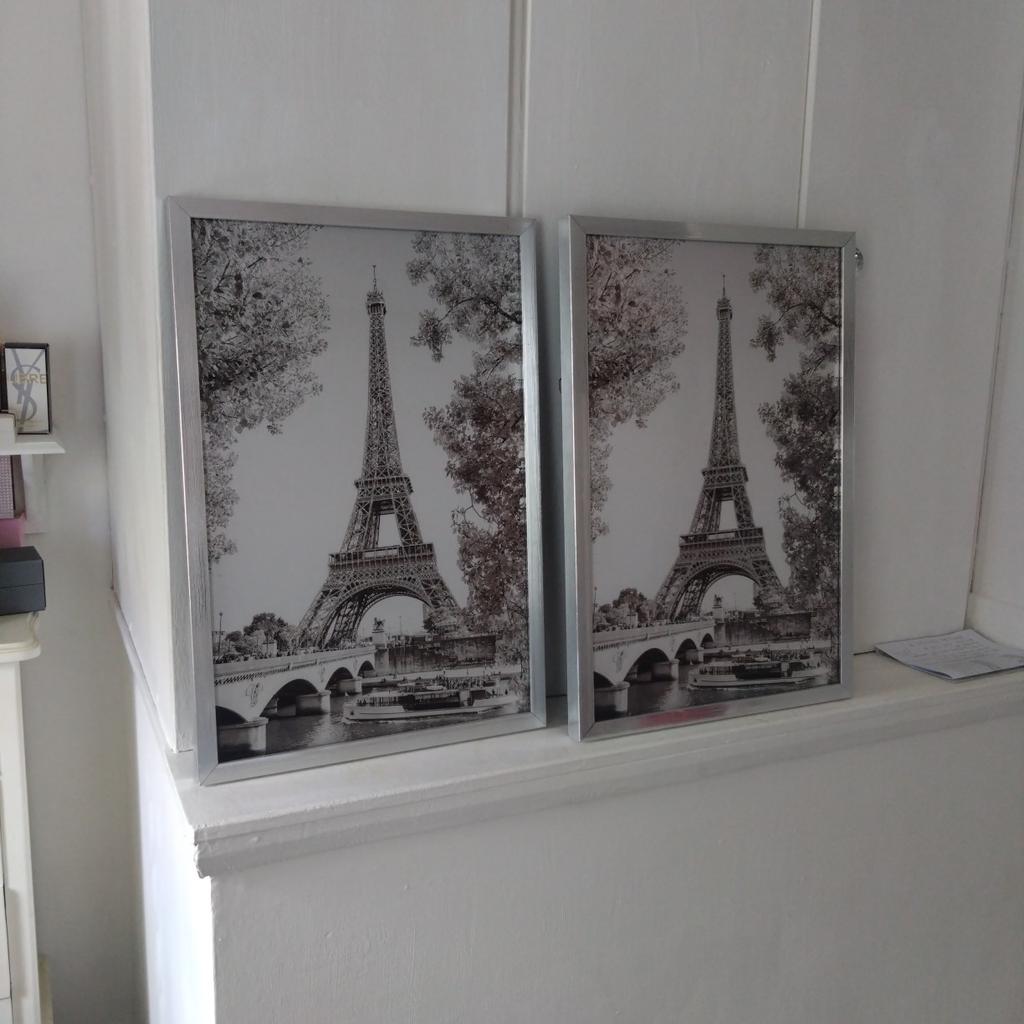 silver sparkle Eiffel tower picture with silver frame.. collection only will sell as a pair for £15.