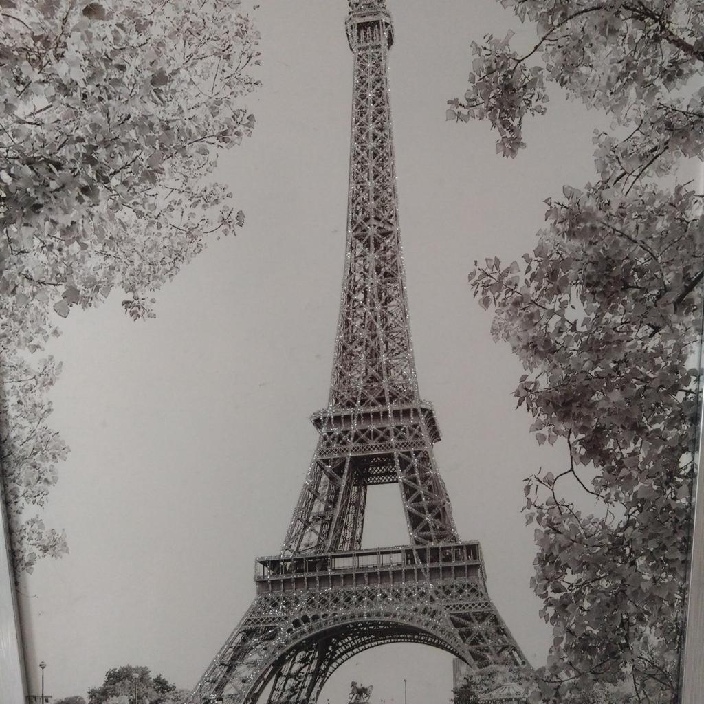 silver sparkle Eiffel tower picture with silver frame.. collection only will sell as a pair for £15.