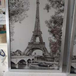 Eiffel tower picture with sparkle and silver frame. collection only. will sell the pair for £15.