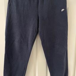 Navy Nike tracksuit bottom. Barely worn despite their age and in good condition.