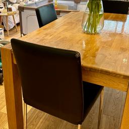 Beautiful solid oak table, solid; comfortably sits 4 up to 6. Some light marks or area varnish has worn off but easily fixed to look brand new. Comes with 4 black pleather seats. All seats but 1 have no marks or blemishes, but the 4th does have tiny mark from toddler teeth!

Length 155cm
Width/depth: 90 cm
Height: 76 cm

Collection only will require car and possibly 2 people. Perfect table for family gatherings and nightly dinners!

80 without chairs, 100 with 