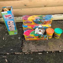 Comes with 2 unopened play doh kits and one opened play doh 
All of the jenga pieces are there