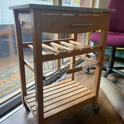 Small rolling kitchen trolley with one drawer, wine rack and basket. Wood and granite top.

Measurements (cm): 58x40x83

Good condition. Collection only.
