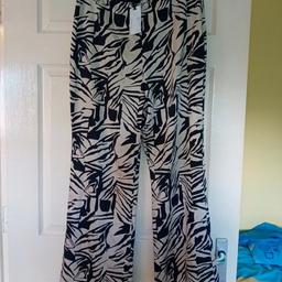 New with tags from primark size 16 small side zip wide leg trousers light silky material 