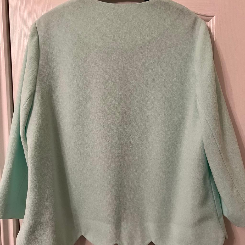 Pretty mint green jacket.hangs edge to 4 length arms.size 14.jacket length 60cm.fully lined inside.from Primark in good condition.lovely little lightweight summer jacket