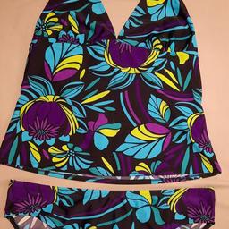 Ladies tropical tankini, has lovely purple, teal & lime. Never worn, no tags, but still has hygiene strip & sticker.