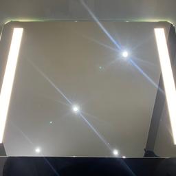 This is a stylish pre loved LED bathroom mirror (with de-mist) by Cooke and Lewis. 
Size 80x60 cm with on/off switch. Its simple design means it is easy to install and connect.  
It’s in excellent condition with no blemishes to the mirror or other parts.