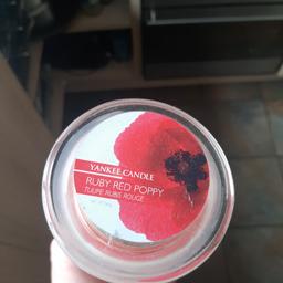 so here I have a very rare and retired jar,Ruby red poppy I dropped a lid off another jar and it smashed the jar the wax inside has never been lit so could still be used or crumbled for wax melt collection only no offers this is a rare sent