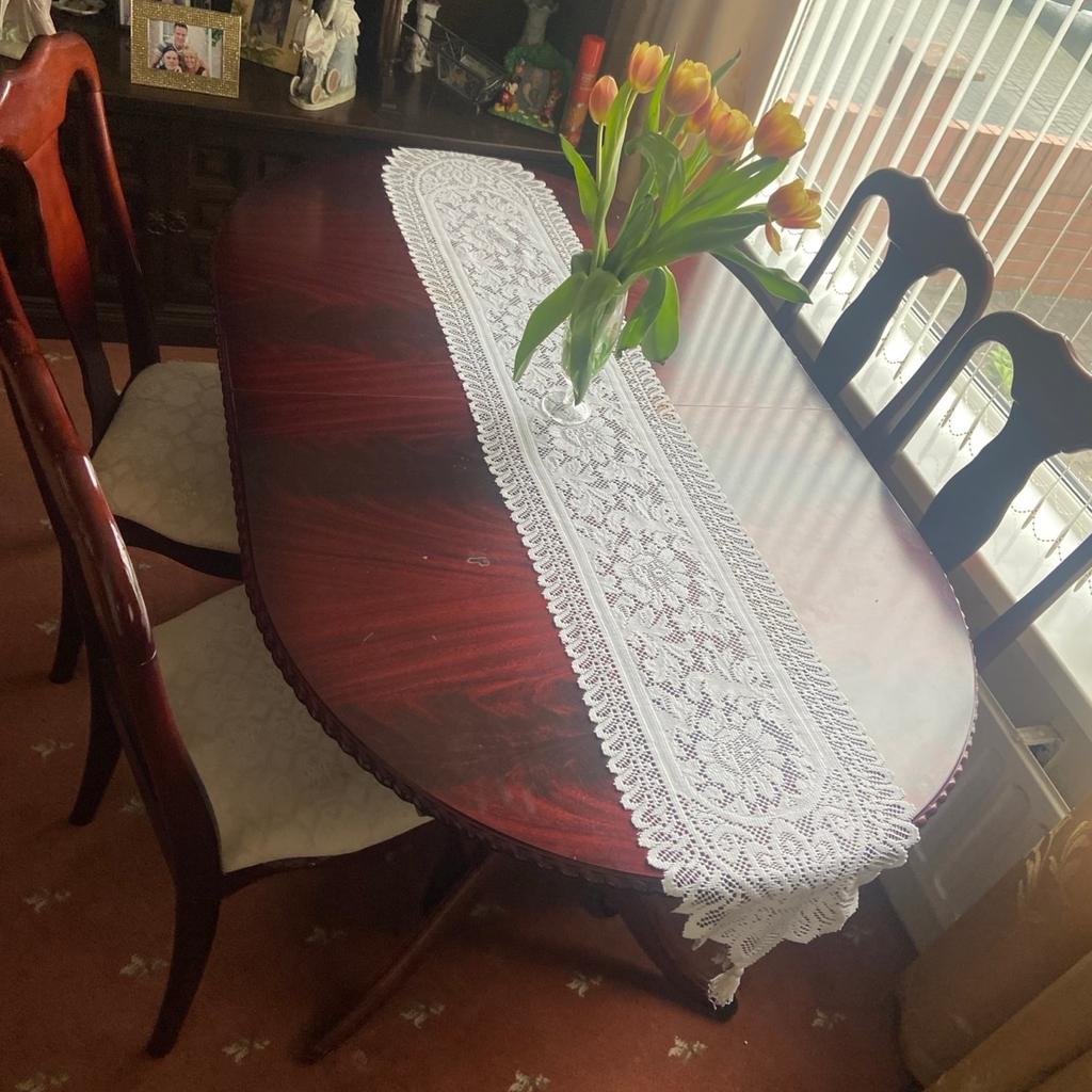 Selling as no longer required 4 mahogany chairs with seat pads and extendable table.
