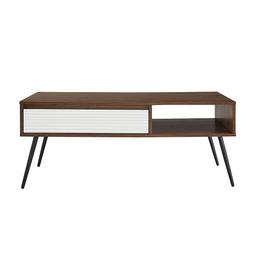 Show off your city - inspired taste with the Birchwood Walnut Drawer Coffee Table. The angled, powder-coated metal legs and fluted drawer front create an urban, contemporary look to elevate your living room, den, or home office. Tuck remotes, electronic accessories, or coasters within the drawer for a tidy aesthetic anyone can appreciate.

L 111.76cm W 55.5cm H 46.3cm