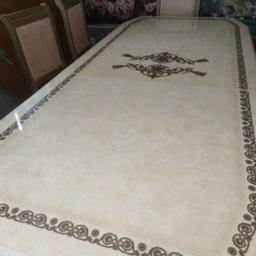 Gold and Cream Marble effect table and 6 chairs, 2 of them carvers. Table is 200cm long without middle extension 250cms long with extension. collection only from DL13 Tow Law. Photos show with and without extension which has a pattern on in the centre of table. Downsizing is reason for sale.