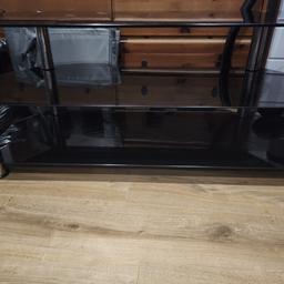 Black & chrome TV stand with 3 shelves. Widest width 114cm, depth 45cm, height 50cm. Collection RG30 3PX.