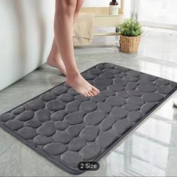 Add comfort and style to your bathroom with this Non-Slip Memory Foam Bath Rug. Made with soft Flannel, memory foam and polyester materials, this Grey bath mat is perfect for adding a touch of elegance to your bathroom decor. Measuring 60cm in length and 40cm in height, it is the ideal size for any bathroom floor.

This Bathroom Floor Mat is perfect for Adults and comes with latex backing that prevents it from slipping. Ideal for keeping your feet warm and dry, this Bath Mat is perfect for daily use. Order now and add a touch of sophistication to your bathroom!