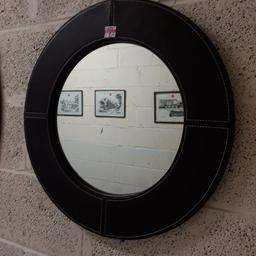 This brown faux leather wall mirror is in good all-round used condition.

23 inches diameter...

Our second hand furniture mill shop is LOW COST MOVES, at St Paul's trading estate, Copley Mill, off Huddersfield Road, Stalybridge SK15 3DN...Delivery available for an extra charge.

There are some large metal gates next to St Paul's church... Go through them, bear immediate left and we are at the bottom of the slope, up from the red steps... 

If you are interested in this or any other item, please contact me on 07734 330574, or on the shop 0161 879 9365...Many thanks, Helen.

We are normally OPEN Monday to Friday from 10 am - 5 pm and Saturday 10 am -  3.30 pm.. CLOSED Sundays. CLOSED Bank Holiday long weekends...