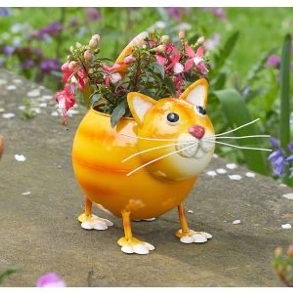 Cat Pot
A choice of two fun animal-shaped planters, available in dog or cat design. A loveable addition to your garden this summer. Perfect for small plants and succulents. Beautiful handpainted finish. Metal. Size: H21.5 x W21 x D14cm. Pot diam. 10cm. Flowers not included.

Brand new