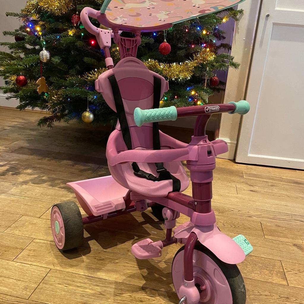 Pink trike for sale, used just a few times. Selling as my daughter has outgrown it. Can be used independently by child or controlled by parent. Sun cover and basket included