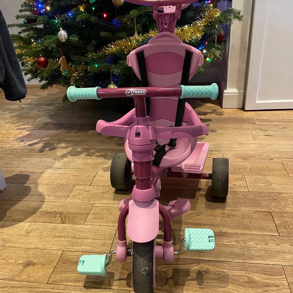 Pink trike for sale, used just a few times. Selling as my daughter has outgrown it. Can be used independently by child or controlled by parent. Sun cover and basket included