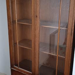 here for sale is a lovely retro display cabinet/bookcase. It has signs of wear and some slight damage to the trim, the lock has been taken off the door at some stage and I'm uncertain why.

it is an attractive unit though and looks great. I may be able to deliver locally but have specified collection as this would only be local
