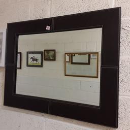 This nice brown faux leather wall mirror is in good all-round used condition.

34.5 inches long x 27 inches high...

Our second hand furniture mill shop is LOW COST MOVES, at St Paul's trading estate, Copley Mill, off Huddersfield Road, Stalybridge SK15 3DN...Delivery available for an extra charge.

There are some large metal gates next to St Paul's church... Go through them, bear immediate left and we are at the bottom of the slope, up from the red steps... 

If you are interested in this or any other item, please contact me on 07734 330574, or on the shop 0161 879 9365...Many thanks, Helen.

We are normally OPEN Monday to Friday from 10 am - 5 pm and Saturday 10 am -  3.30 pm.. CLOSED Sundays. CLOSED Bank Holiday long weekends...