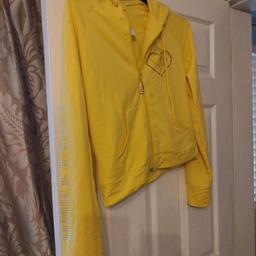 beautiful baby phat yellow hoodie with jeweled details says large however it would be suitable for 10/12. collection only please