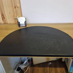 Ikea desk mat, metal with faux leather layer on top. signs of wear and tear but functional.