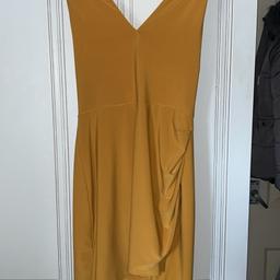 Yellow halter-neck and backless mini dress. Worn twice great condition. Comfy material, great for a party/night out.