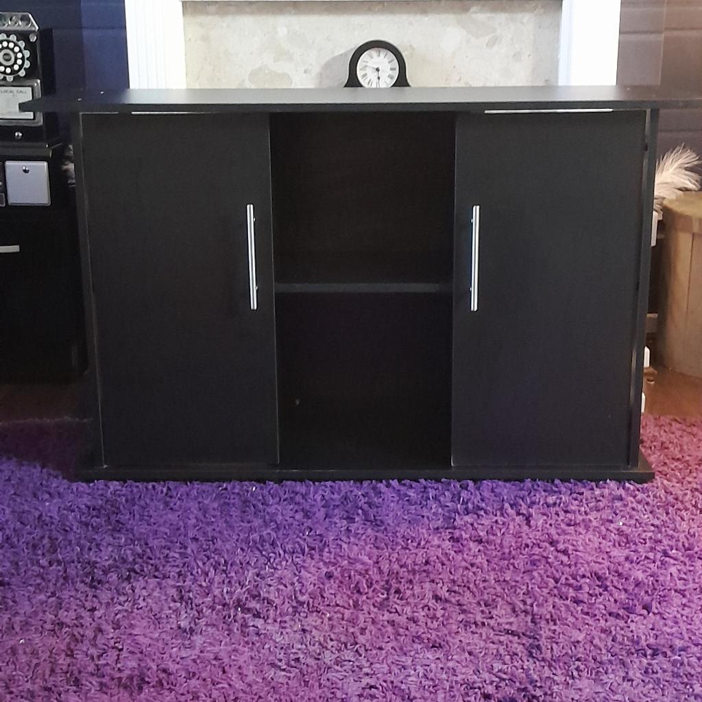 Black unit 4ft x 28inches high.shelf inside each cupboard. contents not included .buyer collects bd6