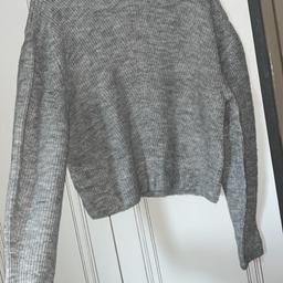 Grey Topshop Knitted jumper. Fairly short, comfortable material. Worn once/twice.