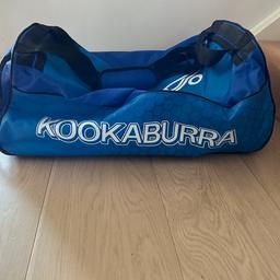 Kookaburra blue cricket bag with wheels.  Used but in reasonable condition.  Zipper in perfect working order.  Natural wear and tear marks (photos here).  Collection from HP1.