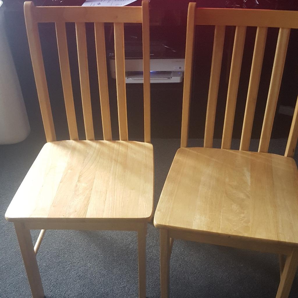 Solid Wood Table & Four Chairs. A great dining set. Table in very good condition, chairs are good but couple of bars underneath the chairs have slight imperfections but they are perfectly functionable. Table measures 45 inches length & 28 inches wide. Only selling as now have a breakfast bar. Table has been dismantled & ready for collection.