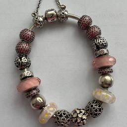 Beautiful Pandora bracelet with charms, spacers and safety chain. Length 20 cms. Pink theme. Cost £775.00