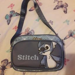 disney lilo and stitch cross body bag.

2 zip compartments and adjustable strap

only removed tags and hung it up in my room.
then got surprised with another.  so I'm selling this 1.

as new condition....practically brand new 

can deliver if you are local for fuel cost or collection if you prefer