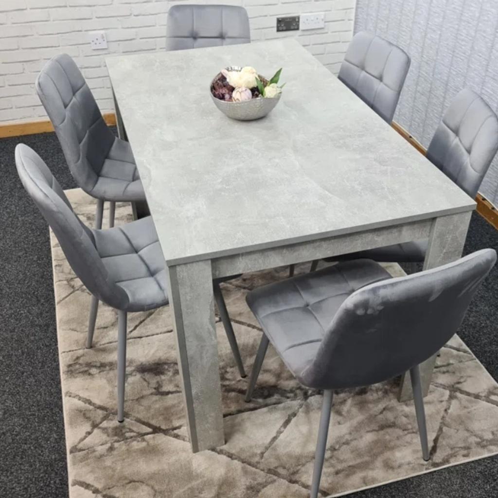 Stone grey table with 6 seater. Transform & brighten your dining area with this stunning, contemporary dining table. The chairs are of a modern design. The table is made from wood and has a melamine laminated light stone grey effect, transforming your dining room and looks so spectacular and unique. The item comes flat-packed and requires some home assembly.

Chairs not included,  Brand new boxed