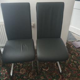 2 leather chairs for dinning room with fair condition